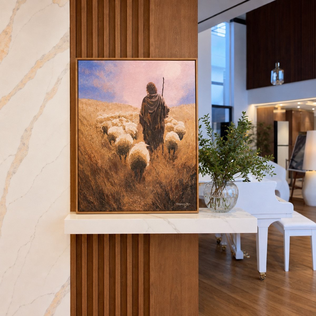 Eternal Shepherd framed on a marble wall at INARA Manor House, a piano beyond
