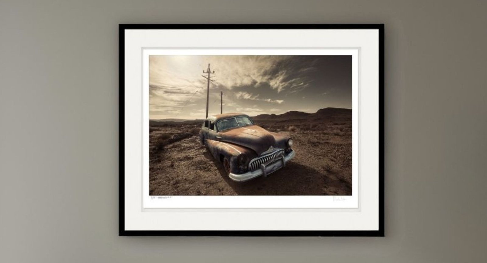 Abandoned No.36 framed in black with a white mount on a grey wall